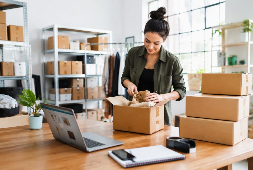 Ecommerce owner packing online orders